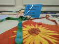 Oranger Stoff mit aufgedruckter Sonnenblume